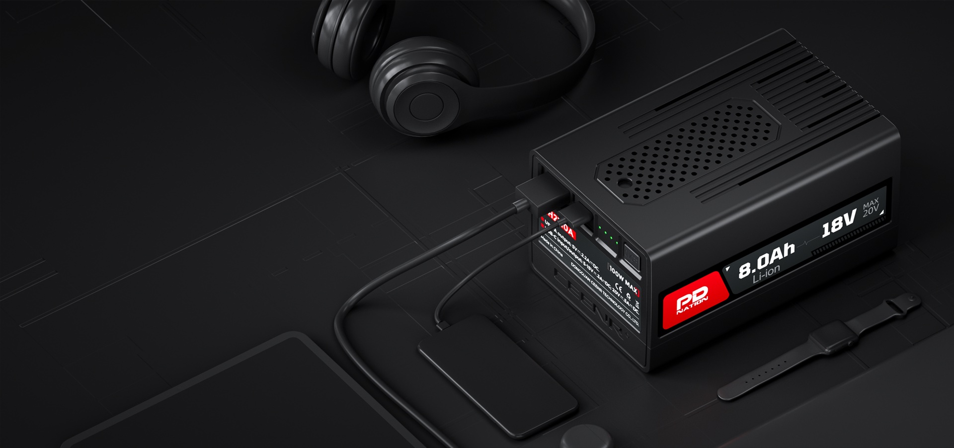PDnation Pro USB-C output charging a phone, with headphones nearby